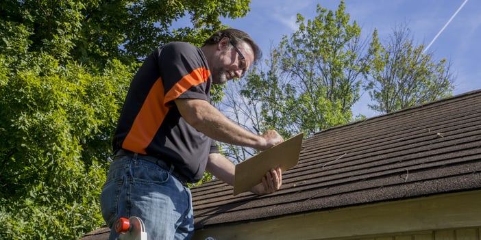 roofer-helping-successfully-deal-with-hail-damage
