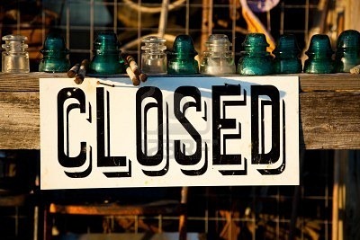 Closed sign in front of a business